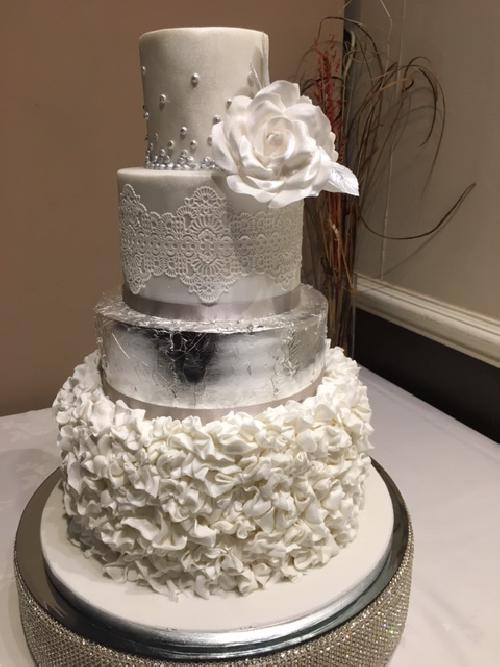 Tall and elegant silver wedding cake